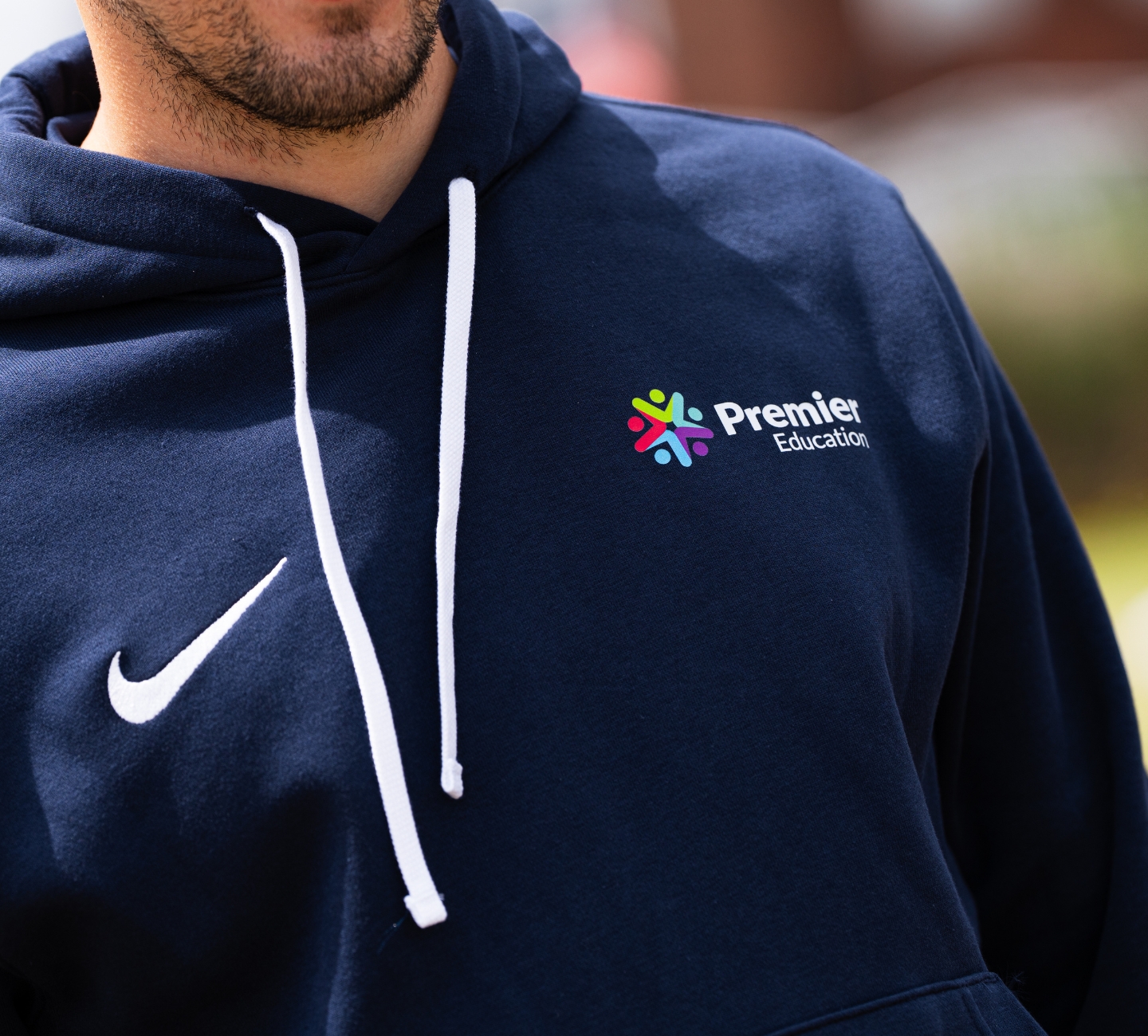 A coach in Premier Education kit.